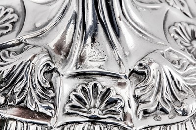 Lot 119 - A pair of George III Irish cast sterling silver candlesticks, Dublin circa 1765-70 by Richard Williams