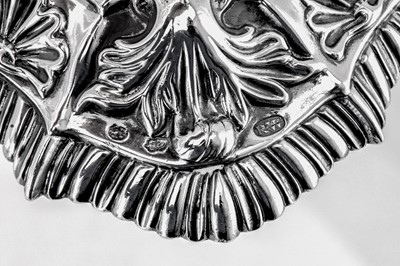 Lot 119 - A pair of George III Irish cast sterling silver candlesticks, Dublin circa 1765-70 by Richard Williams