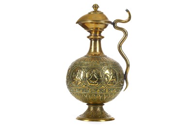 Lot 336 - AN INDIAN LIDDED REPOUSSÉ BRASS EWER  India,...