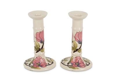 Lot 178 - A pair of Moorcroft pottery candlesticks in...