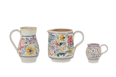 Lot 96 - Poole Pottery - Three jugs, each decorated in...