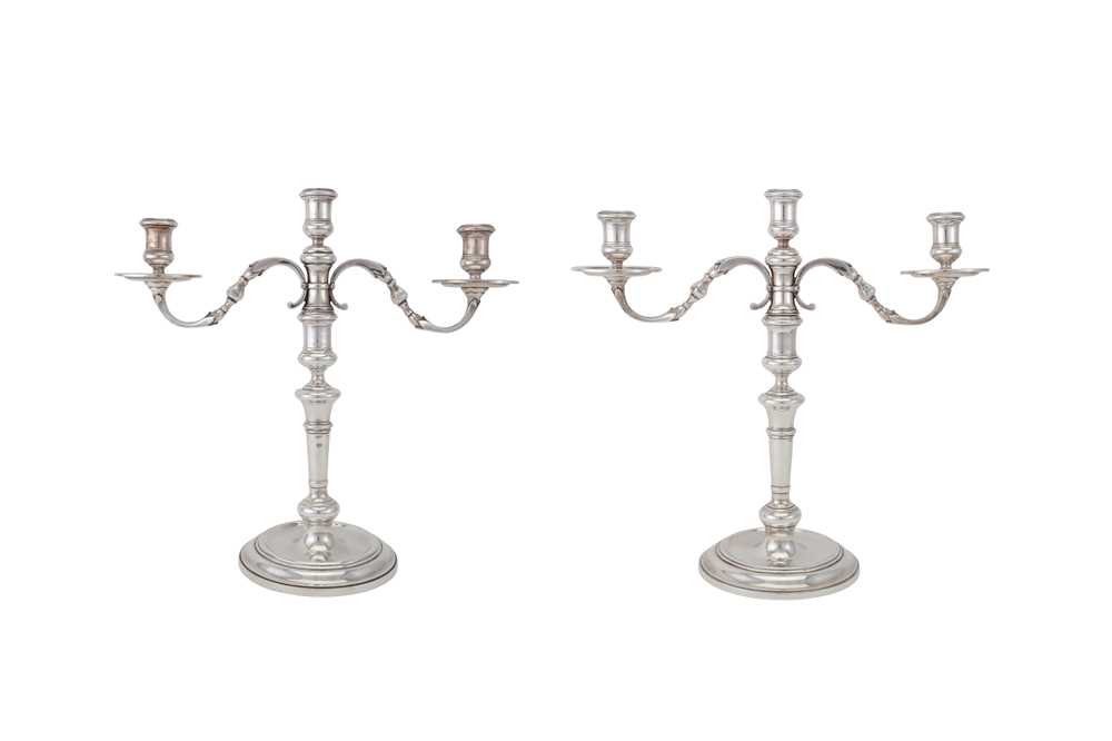 Lot 99 - A pair of Elizabeth II sterling silver three-light candelabra, London 1962 by Apsrey and Co