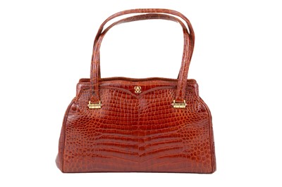 Lot 454 - Mahogany Vintage Baby Crocodile Handbag, gold...