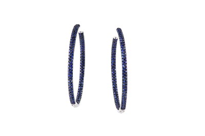 Lot 98 - A pair of sapphire hoop earrings Each hoop...