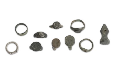 Lot 121 - A GROUP OF BRONZE AND SILVER RINGS  Roman...