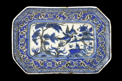 Lot 213 - A QAJAR BLUE AND WHITE POTTERY TRAY Iran, 19th...