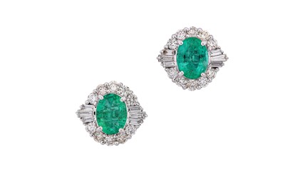 Lot 257 - A pair of emerald and diamond cluster earstuds...