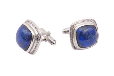 Lot 630 - A pair of lapis lazuli and diamond cufflinks,...