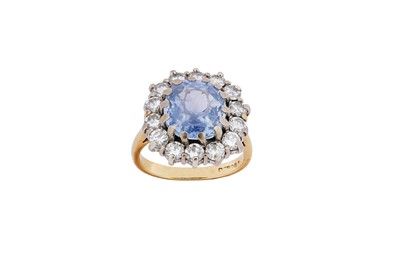 Lot 22 - A sapphire and diamond cluster ring The...
