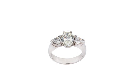 Lot 266 - A diamond three-stone ring The oval-cut...