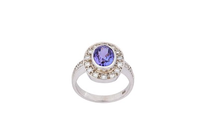 Lot 95 - A tanzanite and diamond ring The oval-shaped...