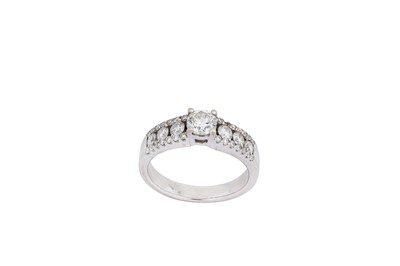 Lot 125 - A diamond ring Centred by a brilliant-cut...