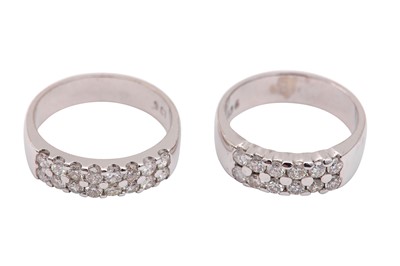 Lot 634 - Two diamond band rings, each pavé-set with a...