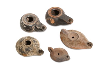 Lot 100 - A GROUP OF OIL LAMPS Circa 1st Millennium B.C....