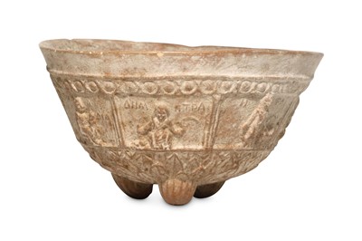 Lot 59 - A GREEK TERRACOTTA VOTIVE VESSEL  Standing on...