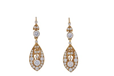 Lot 192 - A pair of diamond pendent earrings Of foliate...