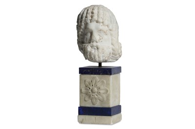 Lot 112 - A MARBLE HEAD OF ZEUS SERAPIS Circa 1st – 2nd...