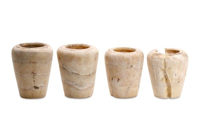 Lot 20 - FOUR EGYPTIAN ALABASTER CANOPIC JARS Late...