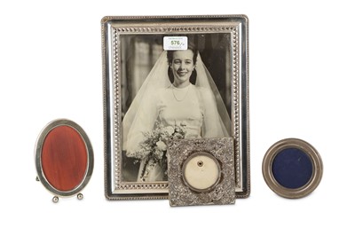 Lot 576 - Four silver photograph frames, the largest a...