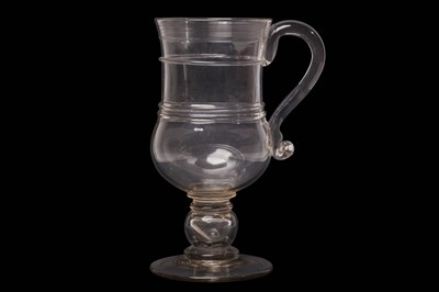 Lot 35 - A VERY LARGE GLASS COIN TANKARD, late 18th...