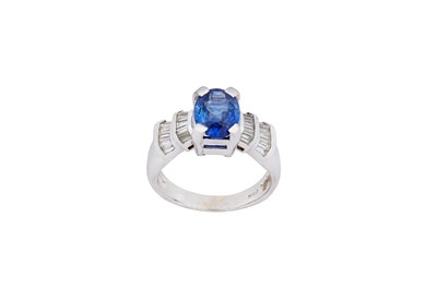 Lot 180 - A sapphire and diamond ring The oval-shaped...