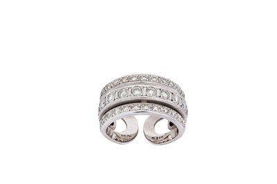 Lot 53 - A diamond-set band ring The wide band,...