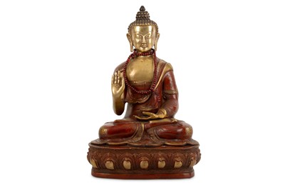 Lot 586 - A contemporary Tibetan painted bronze Buddhist...