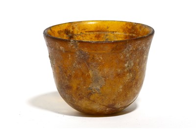 Lot 161 - A ROMAN AMBER GLASS BEAKER Circa 1st - 2nd...