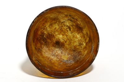 Lot 161 - A ROMAN AMBER GLASS BEAKER Circa 1st - 2nd...