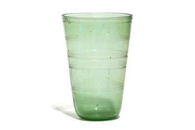 Lot 162 - A ROMAN GREEN GLASS BEAKER Circa 4th Century A....