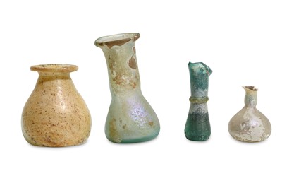 Lot 155 - A GROUP OF ROMAN MINIATURE GLASS VESSELS Circa...