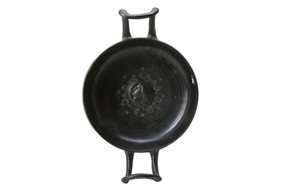 Lot 75 - A GREEK BLACK-GLAZED KYLIX Circa 4th Century B....