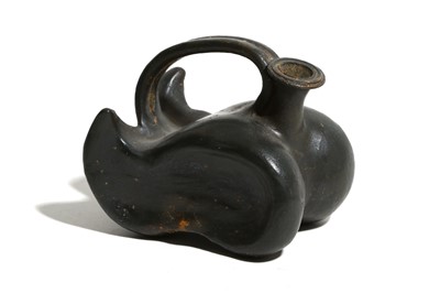 Lot 73 - A GREEK BLACK-GLAZED ASKOS Circa mid 4th...