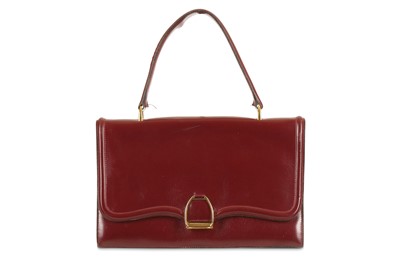 Lot 231 - Hermès Vintage Burgundy Box Stirrup Handbag,...