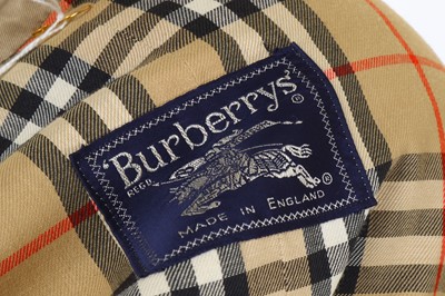 Lot 186 - Burberry Taupe Trench Coat and Matching Hat,...