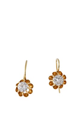 Lot 47 - A pair of diamond earrings  Each polished hoop...