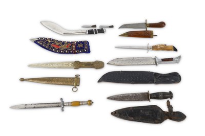 Lot 20 - Seven ethnic knives and daggers, including an...