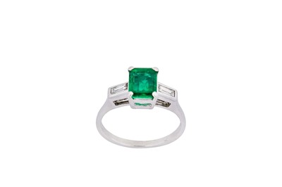 Lot 254 - An emerald and diamond ring The step-cut...