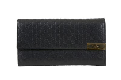 Lot 134 - Gucci Black Guccissima Wallet, embossed logo...