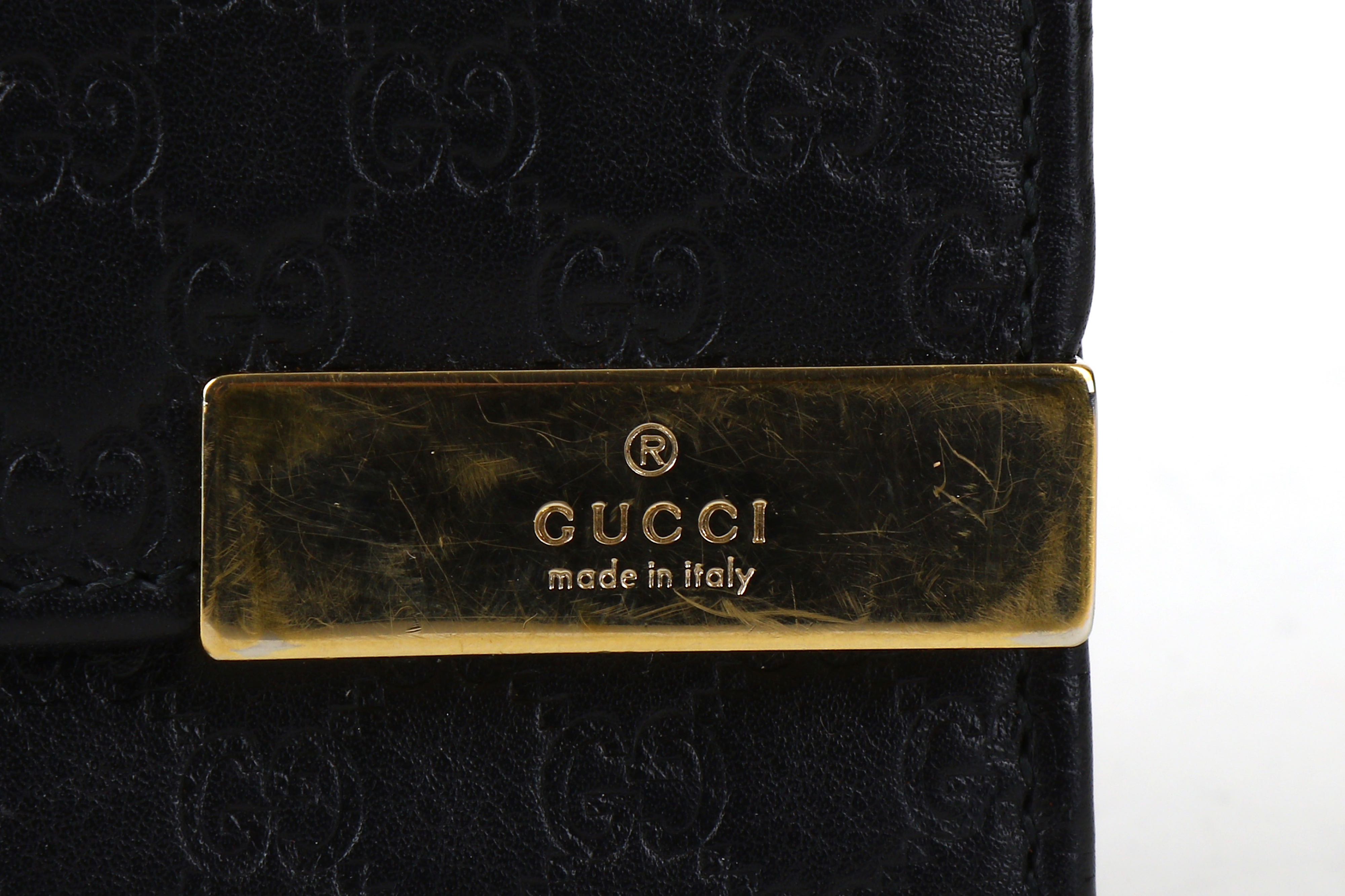 Lot 134 - Gucci Black Guccissima Wallet, embossed logo