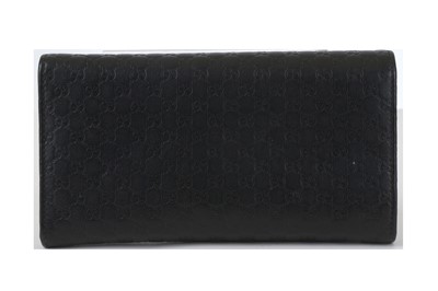 Lot 134 - Gucci Black Guccissima Wallet, embossed logo...