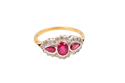 Lot 8 - A ruby and diamond ring, Set with oval and...