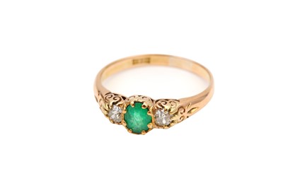 Lot 4 - An emerald and diamond ring, The claw-set oval-...
