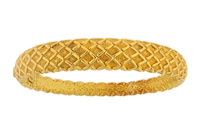 Lot 21 - A hinged bangle Of textured finish, with a...