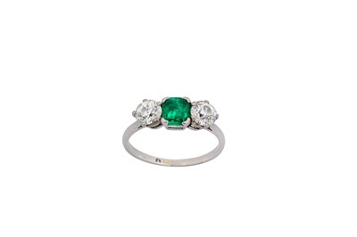 Lot 158 - An emerald and diamond three-stone ring The...