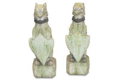 Lot 718 - A pair of reconstituted stone figures of...