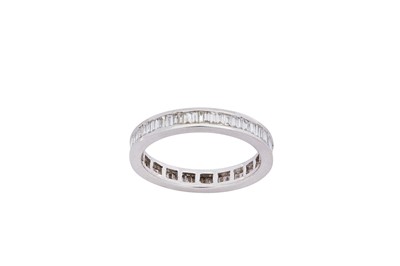 Lot 183 - A diamond eternity ring The channel-set row of...