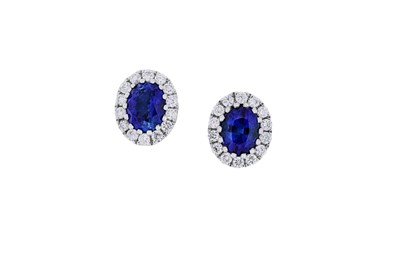 Lot 96 - A pair of sapphire and diamond cluster...