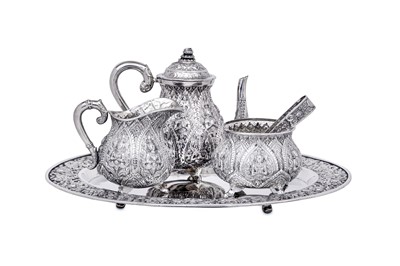 Lot 223 - A mid-20th century Thai silver three-piece tea...