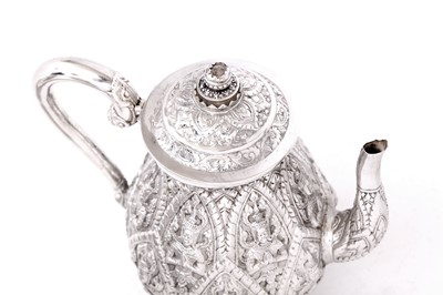 Lot 223 - A mid-20th century Thai silver three-piece tea...